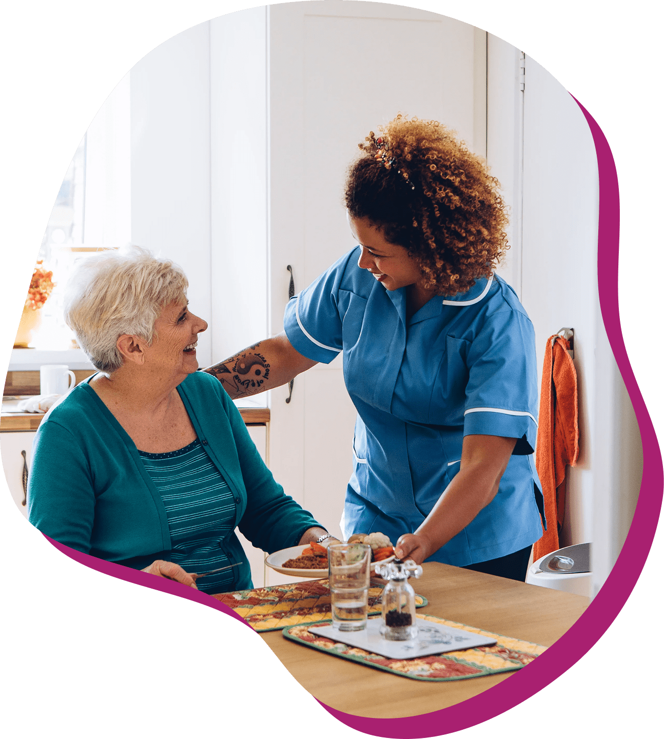 Caregiver assisting elderly woman at home.